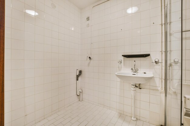 Empty bathroom with white tiled