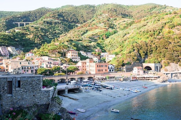 Empty beach with closed umbrellas on italian coast