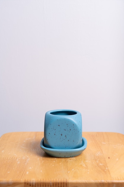 empty and beautiful clay flower pot on wood table