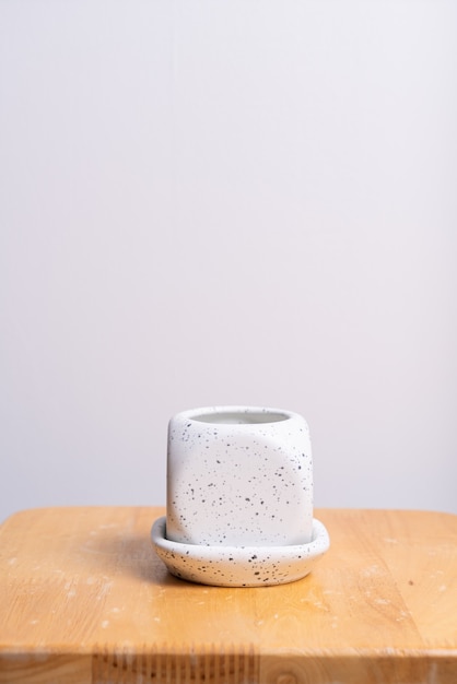 empty and beautiful clay flower pot on wood table