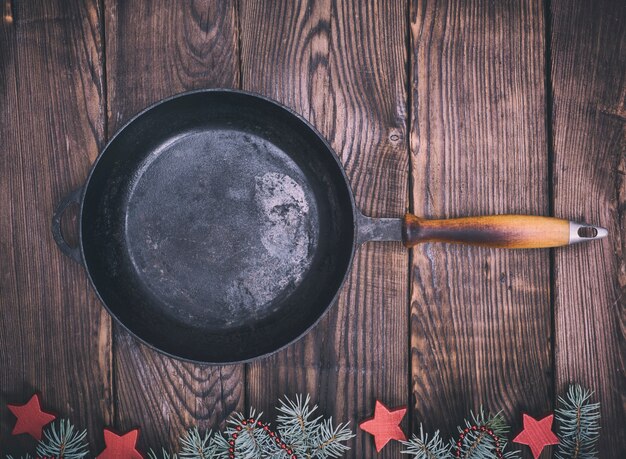 Empty black cast-iron frying pan 