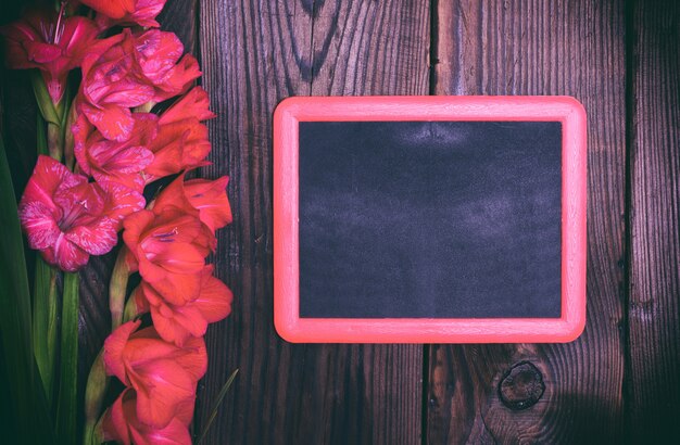 Empty black chalk frame and a bouquet 