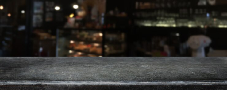 Photo empty black marble stone table top and blurred coffee shop, cafe and restaurant interior background