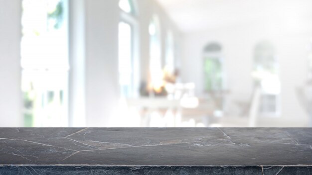 Photo empty black marble stone table top and blurred coffee shop and restaurant interior background.