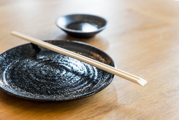 empty black plate on table