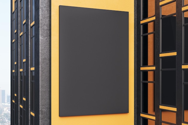 Empty black poster on orange building