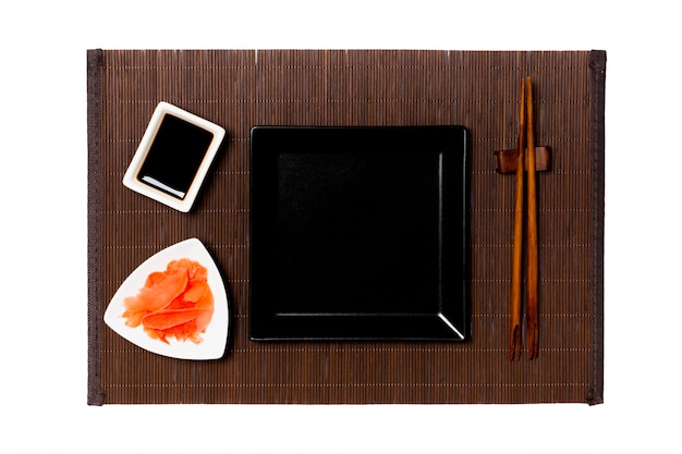 Empty black square plate with chopsticks for sushi