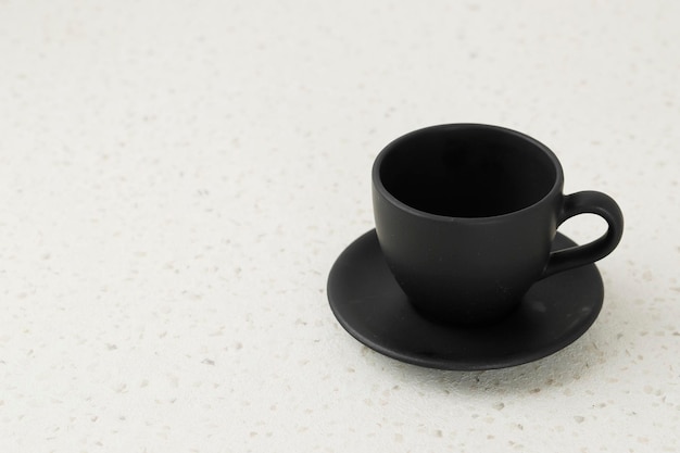 Photo empty black teacup and saucer