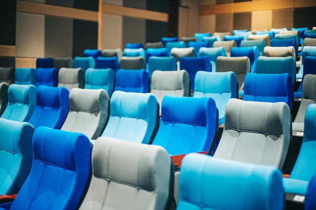 Empty blue cinema seats, chairs. Perspective view