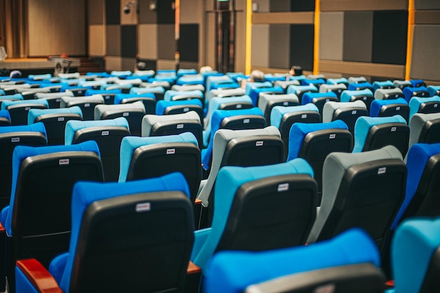 Empty blue cinema seats, chairs. perspective view