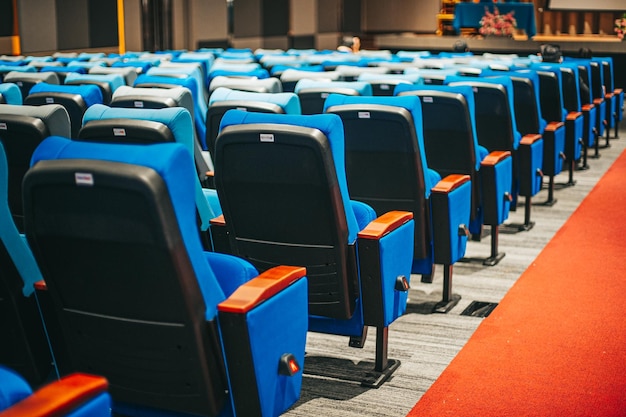 Empty blue cinema seats, chairs. Perspective view