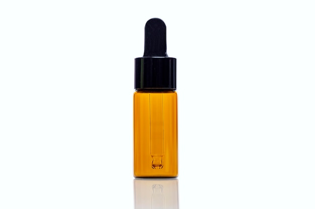 empty bottle with a dark glass pipette perfumes cosmetics and essential oils closeup space for text