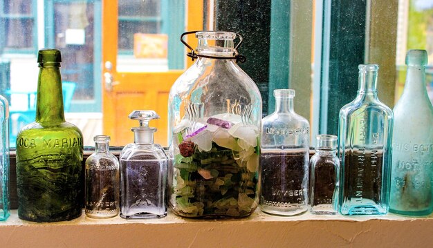 Photo empty bottles on widow sill