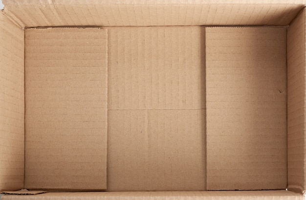 Empty bottom of opened cardboard brown box