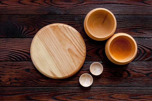 Empty bowls on brown wooden