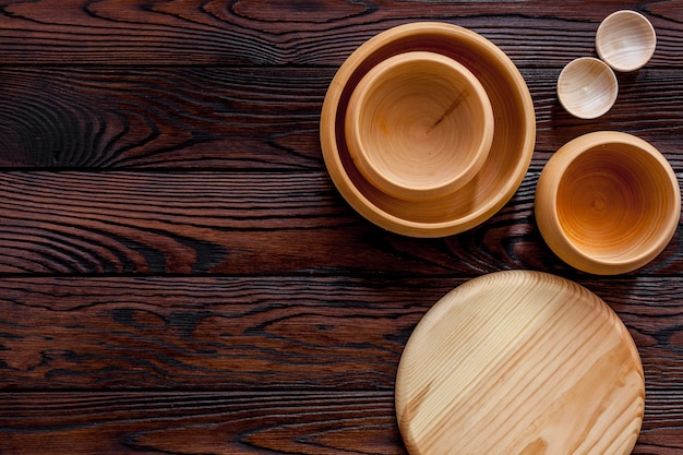 Empty bowls on brown wooden