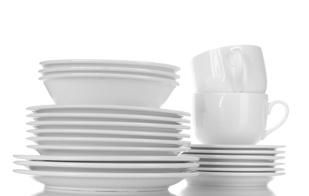 Empty bowls plates and cups isolated on white