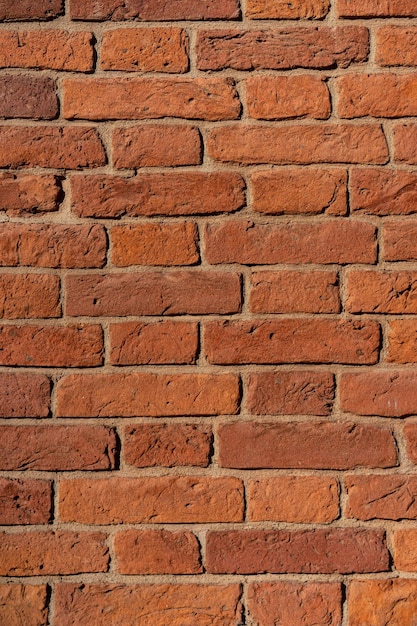 Empty brick red wall background of a old brick house.