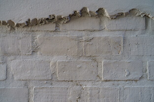 Empty Brick Wall Texture. Painted grunge white stonewall surface  background.