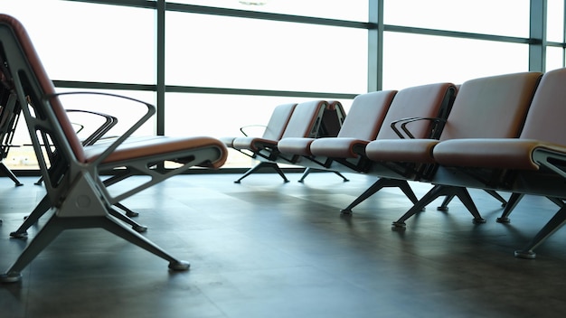 Empty brown leather chairs in airport lounge