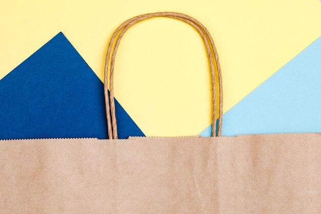 Empty brown paper shopping bag with Handles.