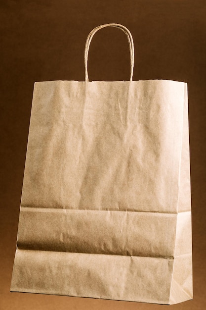 Empty brown paper shopping bag with Handles