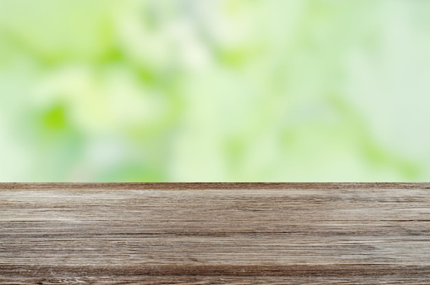 An empty brown wooden table Blurry summer or spring background