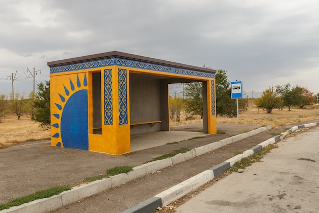 Empty bus stop on the road in Kazakhstan, waiting place for the bus