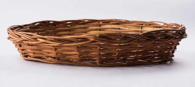 Empty cane basket or tokri in hindi and topli in marathi, isolated over white background