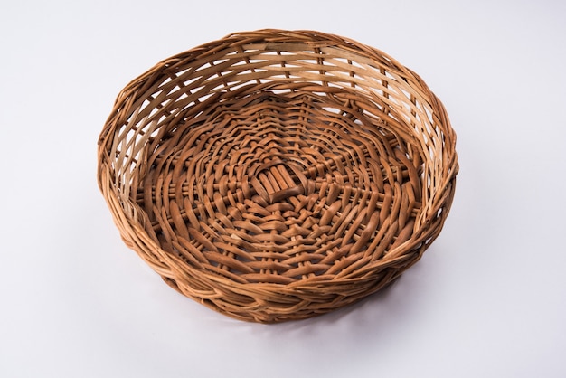 Empty cane basket or tokri in hindi and topli in marathi, isolated over white background