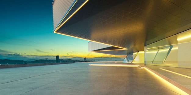 Empty cement floor with modern building exterior cityscape background