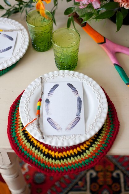 Empty ceramic dish with blank menu tag on table