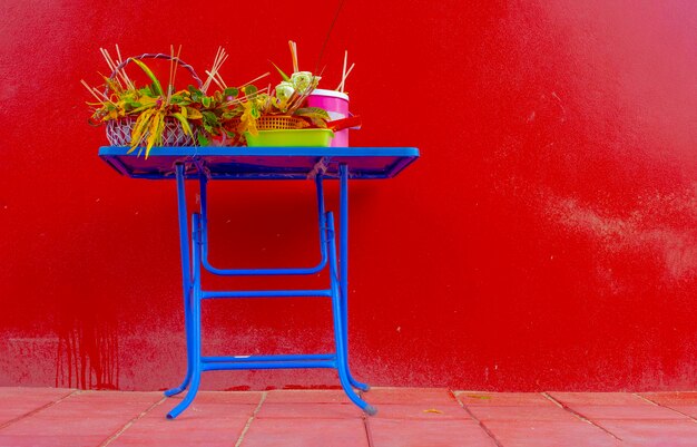 Empty chair against red wall