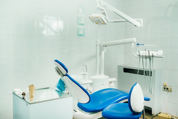 An empty chair in the dentist's office.