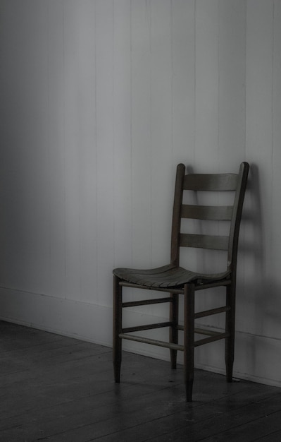 Empty chairs against wall at home