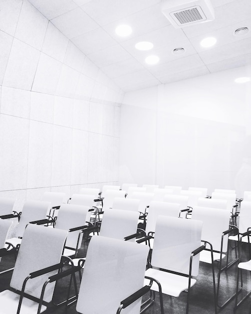 Empty chairs and table in classroom