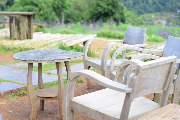 Empty chairs and table in park