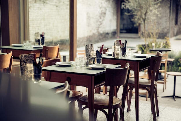 Empty chairs and tables in cafe