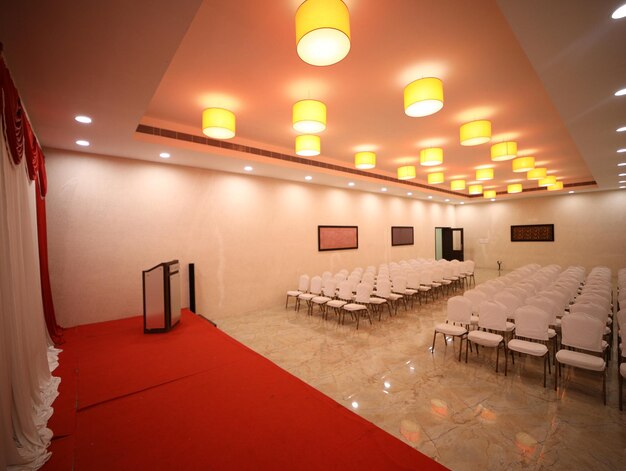 empty chairs and tables in illuminated room