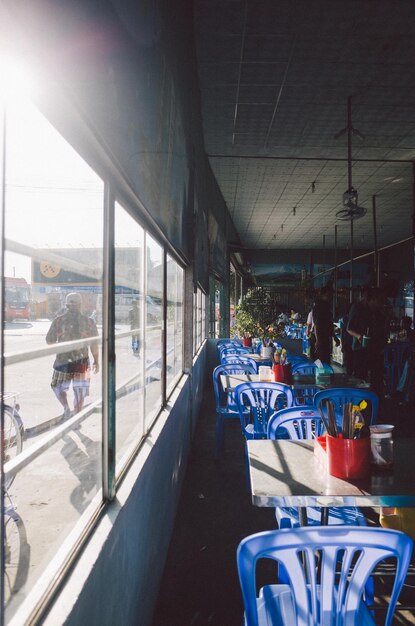 Empty chairs and tables in restaurant