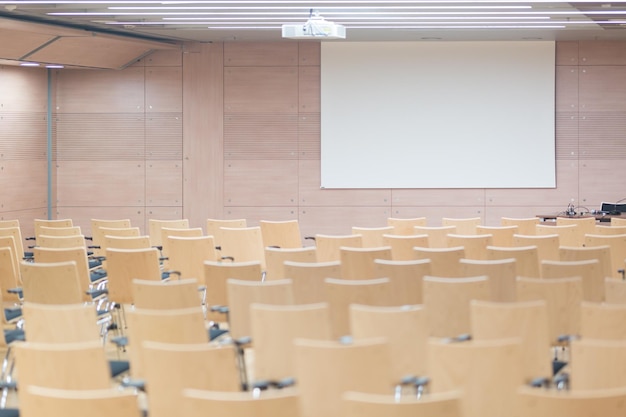 Empty chairs and tables in row