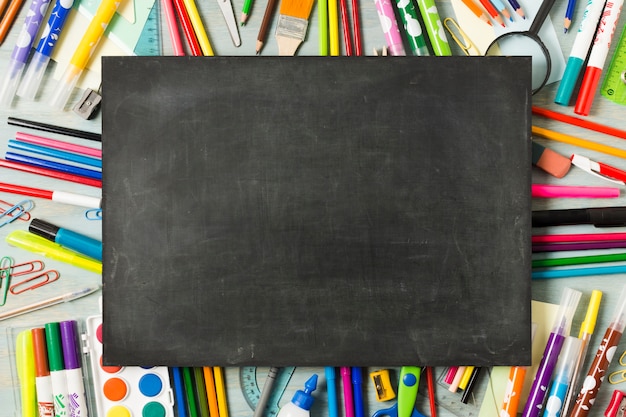 Empty chalkboard on a colourful background