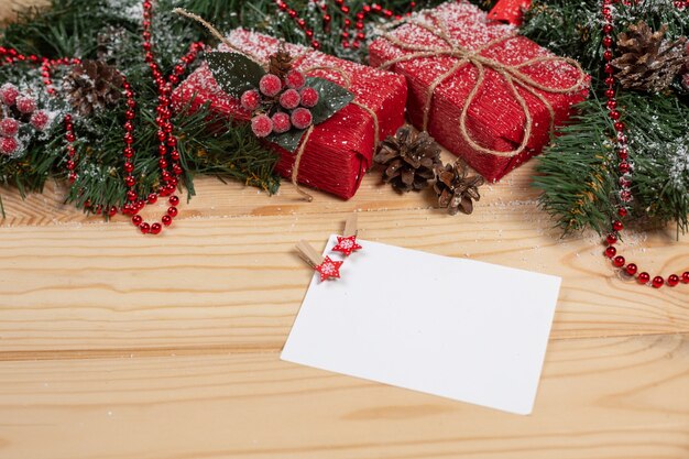 Empty Christmas card on a wooden table