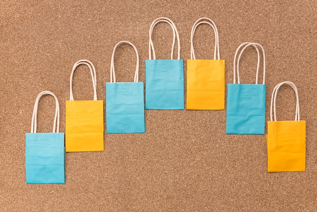 Empty colourful paper packages in curved line