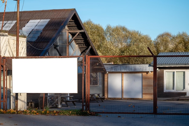 Empty commercial or information banners mounted on metal fence