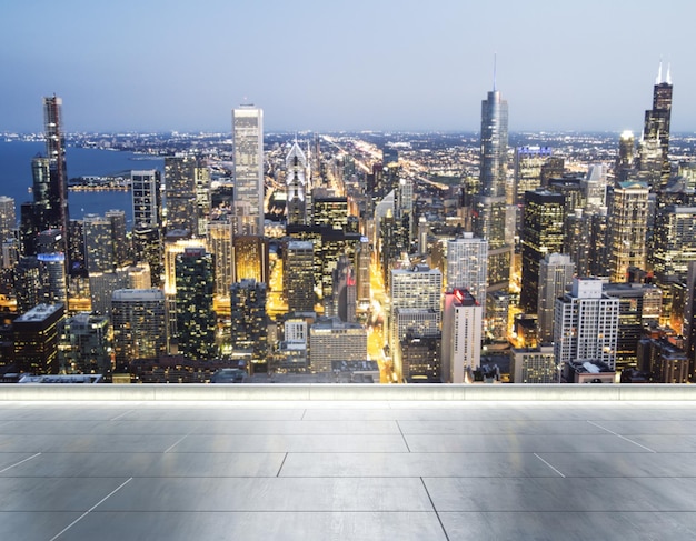 Empty concrete rooftop on the background of a beautiful blurry\
chicago city skyline at evening mockup