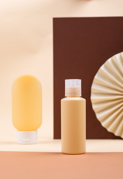 Empty cosmetic tube with paper decoration in beige color