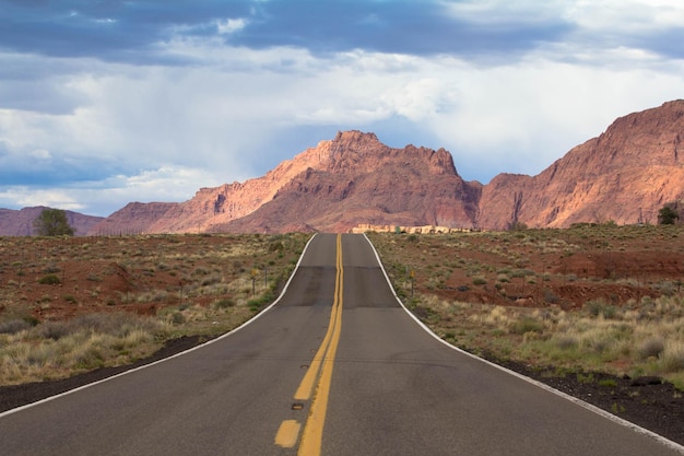 empty country road in desert against sky