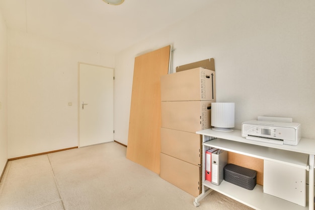 Empty cozy room with boxes and desk