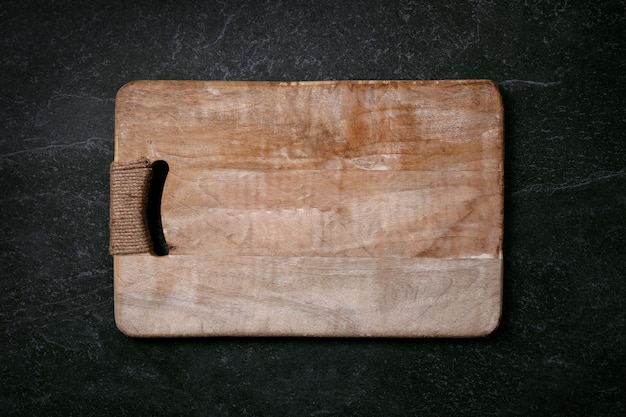 Empty cutting board on marble layout